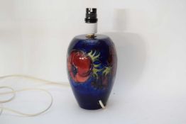 Moorcroft table lamp with a tube lined floral design on blue