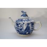 Small tea pot with a blue and white design and a cover with Dog of Fo finial
