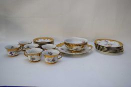 Group of tea wares with gilt borders and floral design