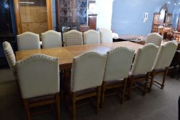 Large 20th century oak extending dining table together with a set of 12 accompanying chairs, table