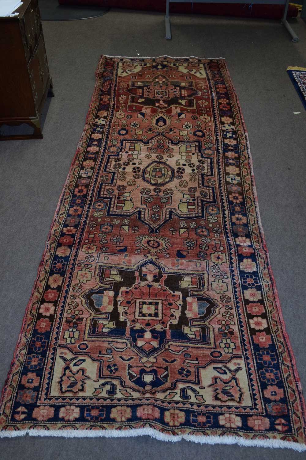 Karajeh runner carpet decorated with large medallions on a red background with geometric border - Image 3 of 4