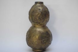 Chinese metal ware bronzed effect double gourd vase decorated with dragons chasing the flaming