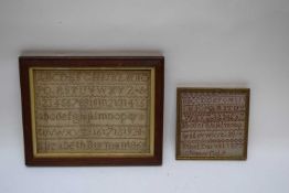 Two needlework samplers decorated with rows of letters and numbers, one signed 'Ethel Darvill