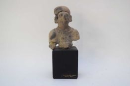 Columbian Tumaco bust on a wooden black plinth, together with original receipt dated August 1974