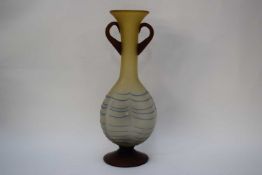 Art glass vase of dimpled shape with loop handles and a trailing blue design, 34cm high