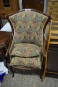 EDWARDIAN MAHOGANY FRAMED WING BACK ARMCHAIR UPHOLSTERED IN FLORAL FABRIC, 108CM HIGH