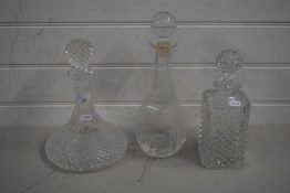 THREE MODERN CLEAR GLASS DECANTERS