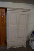 20TH CENTURY PAINTED PINE TWO-DOOR WARDROBE RAISED ON A SINGLE DRAWER BASE