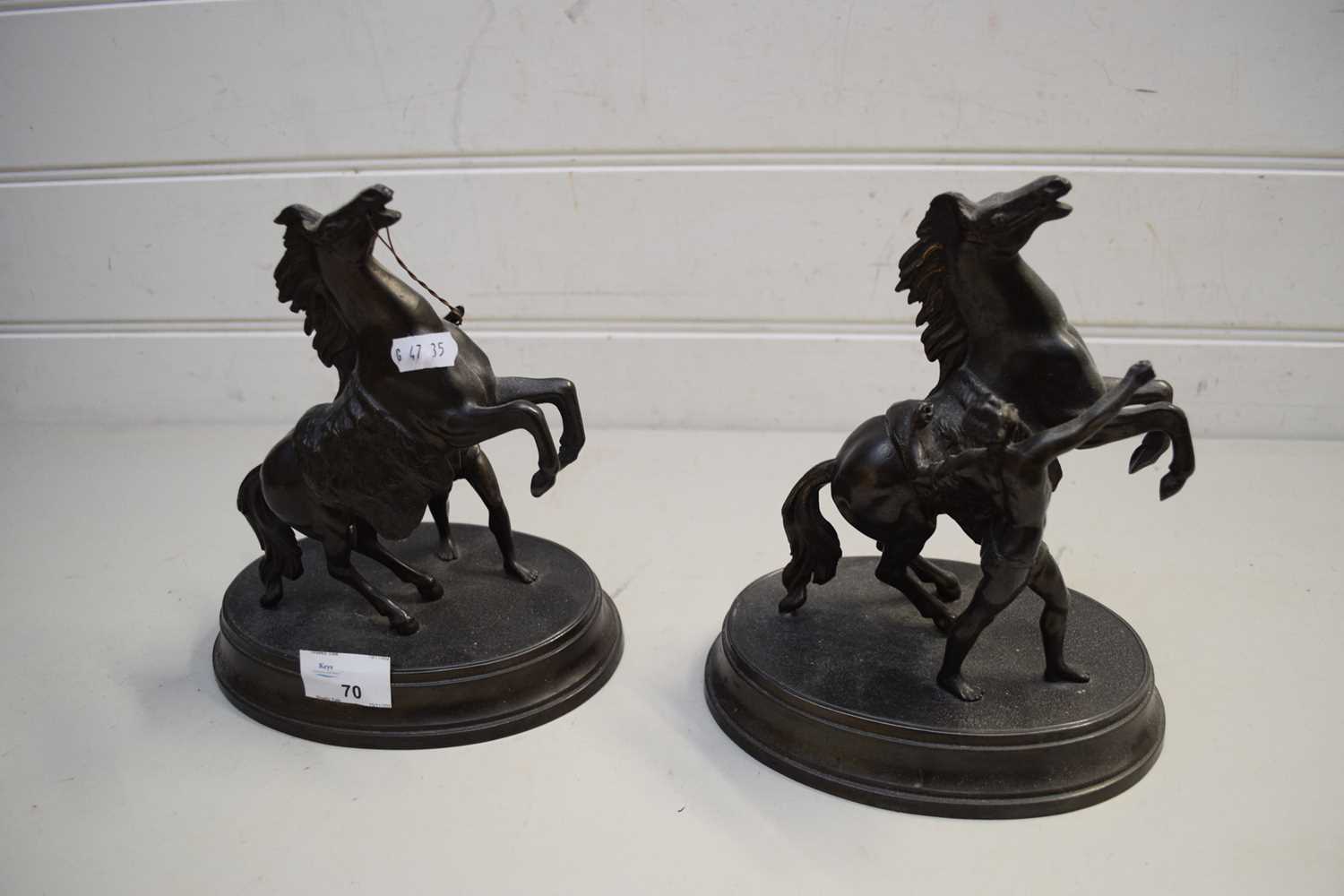 PAIR OF BRONZED SPELTER MARLEY HORSE MODELS ON OVAL PLINTH BASES