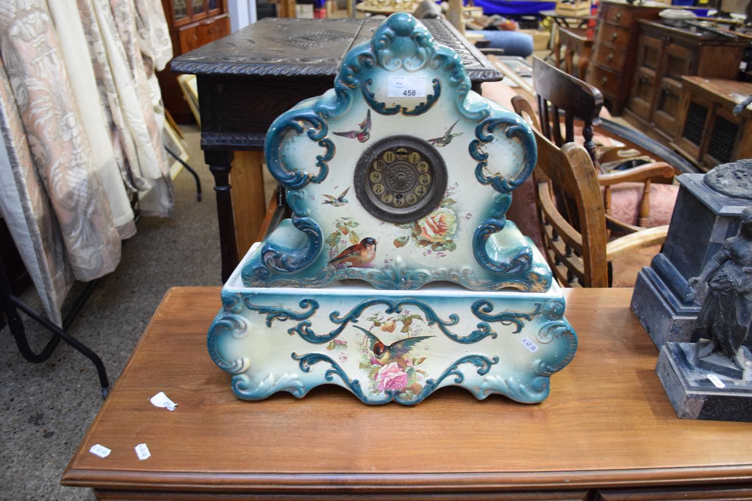 LATE 19TH/EARLY 20TH CENTURY CERAMIC CASED MANTEL CLOCK AND ACCOMPANYING STAND DECORATED WITH BIRDS,