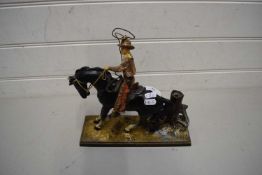 PAINTED CAST METAL MODEL OF A COWBOY ON HORSEBACK