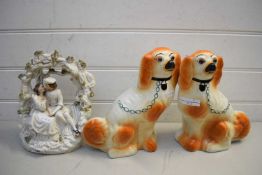 PAIR OF 20TH CENTURY STAFFORDSHIRE STYLE DOGS TOGETHER WITH A VICTORIAN MODEL OF A COUPLE IN A