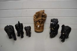 FIVE EBONY ELEPHANTS TOGETHER WITH A FURTHER HARDWOOD TRIBAL FIGURAL PLAQUE