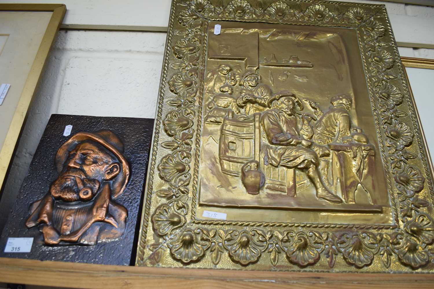 PRESSED BRASS PICTURE DECORATED WITH A 19TH CENTURY TAVERN SCENE, TOGETHER WITH A FURTHER BRONZE