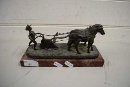 BRONZED METAL MODEL OF A PLOUGHMAN WITH TWO HORSES RAISED ON A MARBLE PLINTH BASE