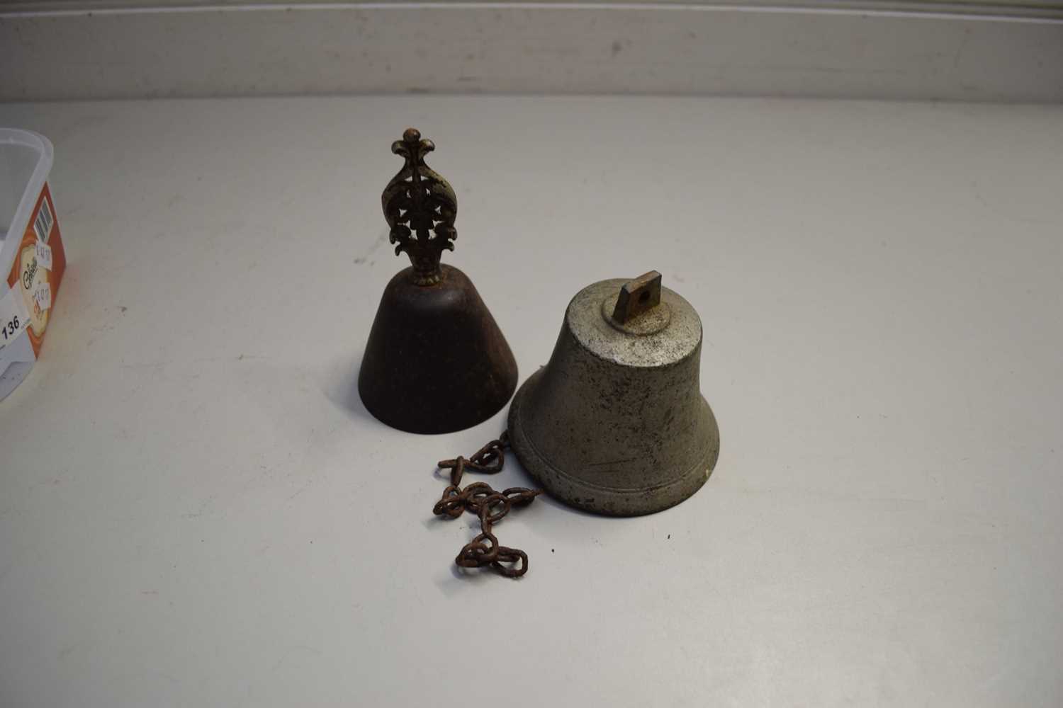 SMALL HAND BELL WITH FOLIATE HANDLE TOGETHER WITH A FURTHER HANGING BELL (2)