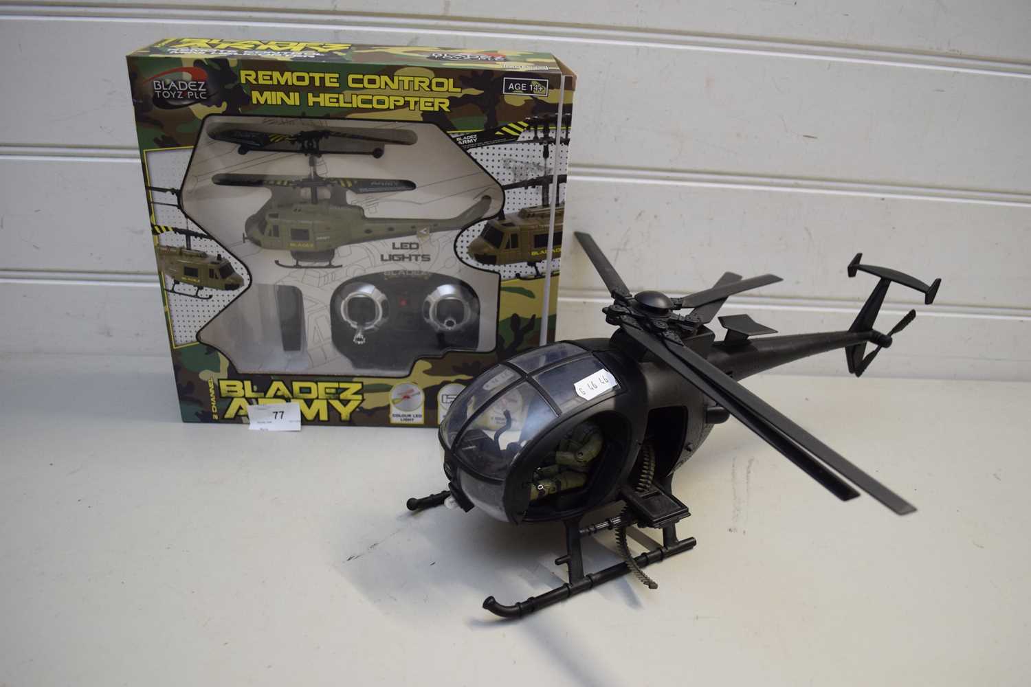 REMOTE CONTROL MINI HELICOPTER TOGETHER WITH A FURTHER MODEL HELICOPTER