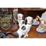 PAIR OF REPRODUCTION STAFFORDSHIRE SPANIELS, 24CM HIGH