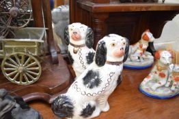 PAIR OF REPRODUCTION STAFFORDSHIRE SPANIELS, 24CM HIGH