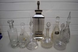 VARIOUS GLASS DECANTERS AND A TABLE LAMP BASE