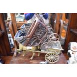 BRASS HORSE AND CART, 39CM WIDE TOGETHER WITH A MINIATURE IRON FRAMED PRAM (2)