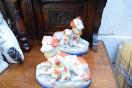 PAIR OF REPRODUCTION STAFFORDSHIRE MODELS OF DOGS WITH PUPPIES