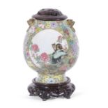 Large Chinese porcelain millefleur vase, of ovoid shape with a panel of famille rose flowers and a