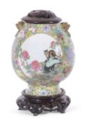 Large Chinese porcelain millefleur vase, of ovoid shape with a panel of famille rose flowers and a