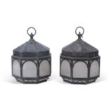 Pair of early 20th century octagonal metal lanterns, the sides set with frosted opaque glass