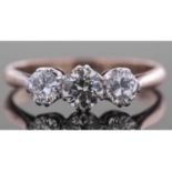 Three stone diamond ring featuring three graduated round brilliant cut diamonds, total ct wt 0.80