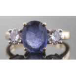 18ct gold sapphire and diamond three stone ring, the oval faceted sapphire 9.92 x 8.03 x 3.92mm,