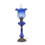 Late 19th century oil lamp, the blue glass shade with floral design above a Bohemian style blue