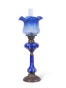 Late 19th century oil lamp, the blue glass shade with floral design above a Bohemian style blue