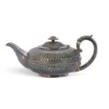 William IV silver tea pot of melon form, fluted decoration, gadrooned body band, foliate engraved