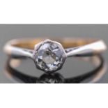 Antique diamond single stone ring featuring a old cut diamond in a rub-over setting, raised