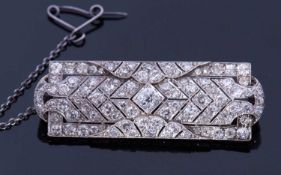 Precious metal Art Deco diamond set brooch of shaped rectangular form, set throughout with graduated