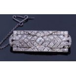 Precious metal Art Deco diamond set brooch of shaped rectangular form, set throughout with graduated