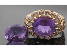 18ct gold amethyst and diamond ring, the oval faceted amethyst multi-claw set and raised above a