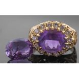 18ct gold amethyst and diamond ring, the oval faceted amethyst multi-claw set and raised above a