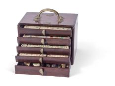 Chinese Mah Jong set in a hardwood case with metal mounts, the lift off front revealing five drawers