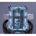 Large aquamarine dress ring of stepped cut, 15.63 x 12.21 x 8.56mm, raised in between textured