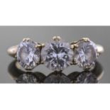 Three stone diamond ring featuring three round graduated brilliant cut diamonds, total ct weight 3.