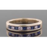 Diamond and sapphire half hoop ring, alternate channel set with four round brilliant cut diamonds,