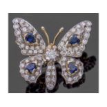 Diamond and sapphire butterfly brooch, the outstretched wings and body decorated with four pear
