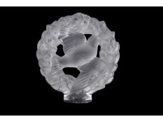 Lalique model of a bird surrounded by floral garland on circular base