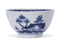 Early Lowestoft porcelain tea bowl, painted in blue with a house and trees and sailing ship, the