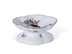 Mid-18th century Meissen salt decorated in botanical style with scattered flowers beneath a gold rim