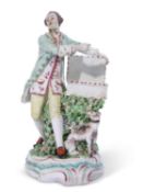 Derby patchmark sweetmeat figure circa 1765 modelled as a gentleman with a dog by his side, 22cm