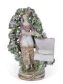 Chelsea Derby sweetmeat figure of a young girl holding flowers with bocage, 22cm high