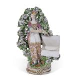 Chelsea Derby sweetmeat figure of a young girl holding flowers with bocage, 22cm high